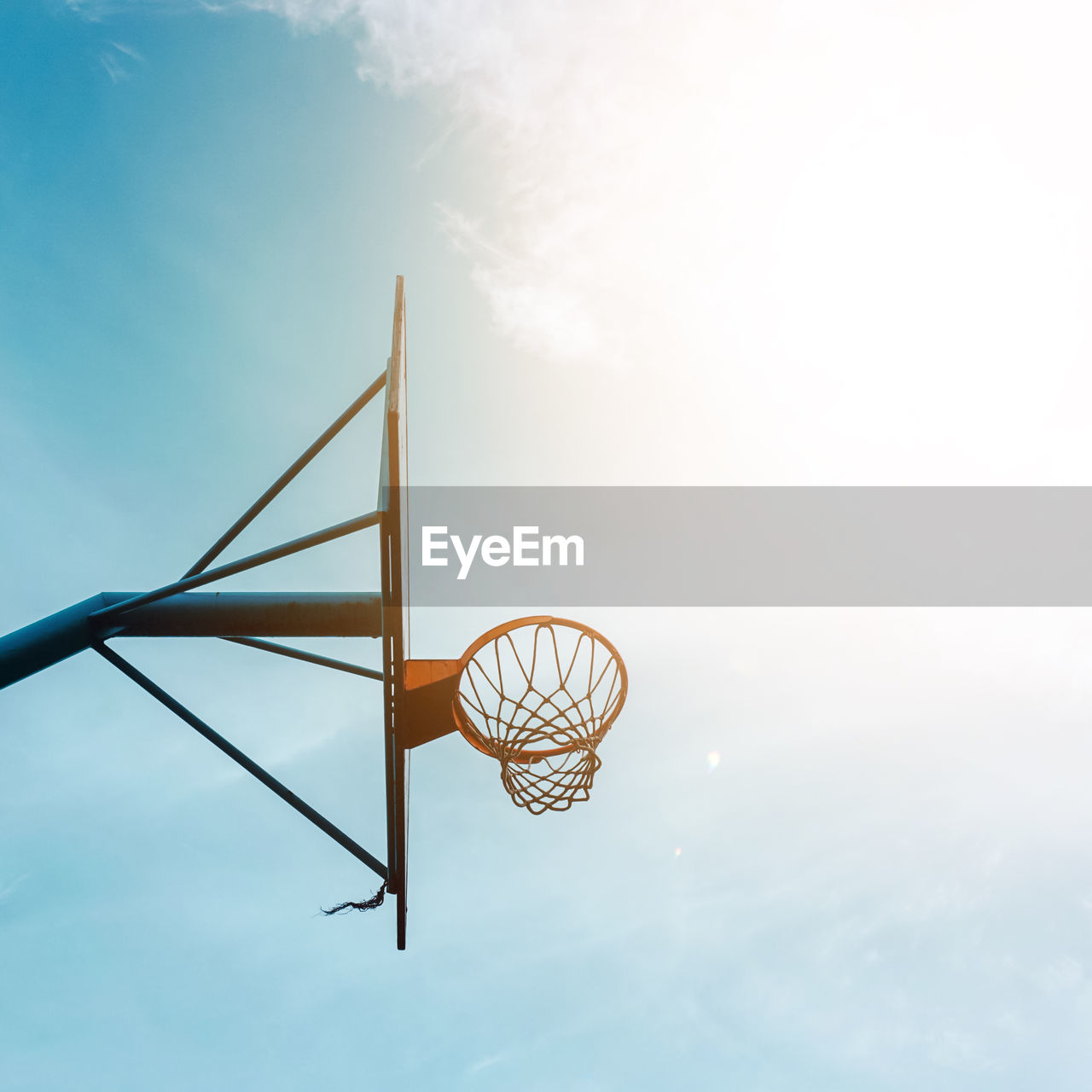 Street basketball hoop and blue sky