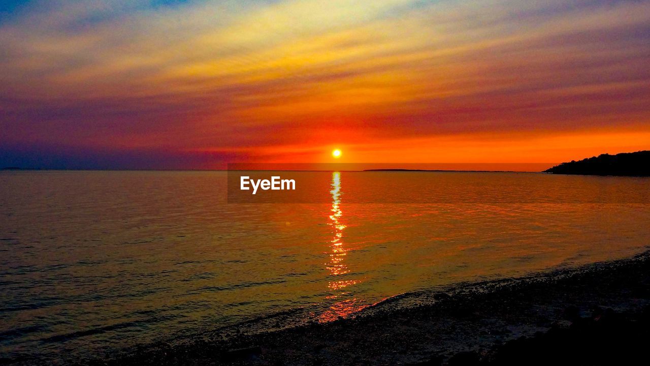 SCENIC VIEW OF SEA AGAINST ROMANTIC SKY