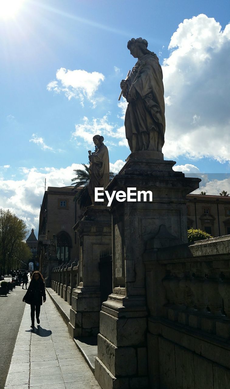 STATUE IN FRONT OF BUILDINGS