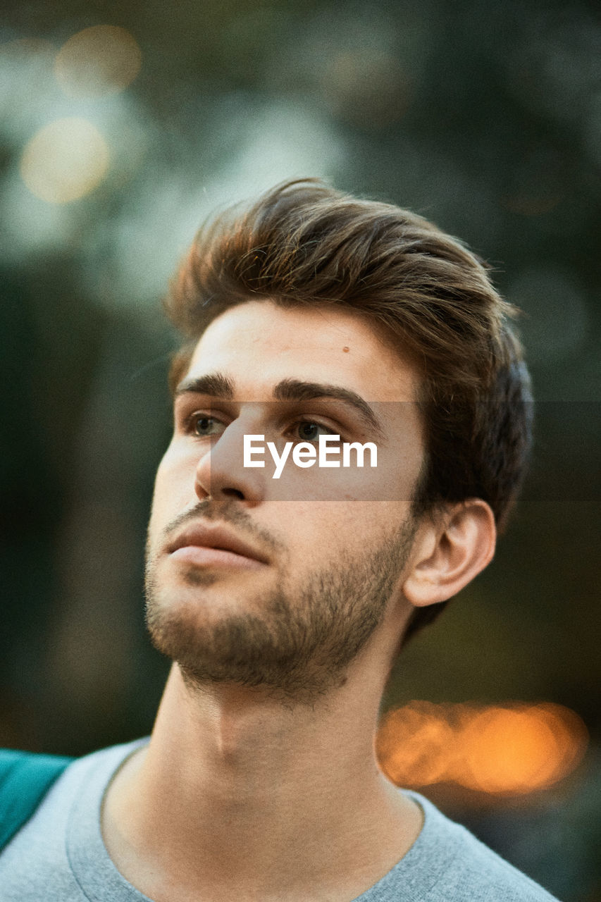 Close-up of young man looking away