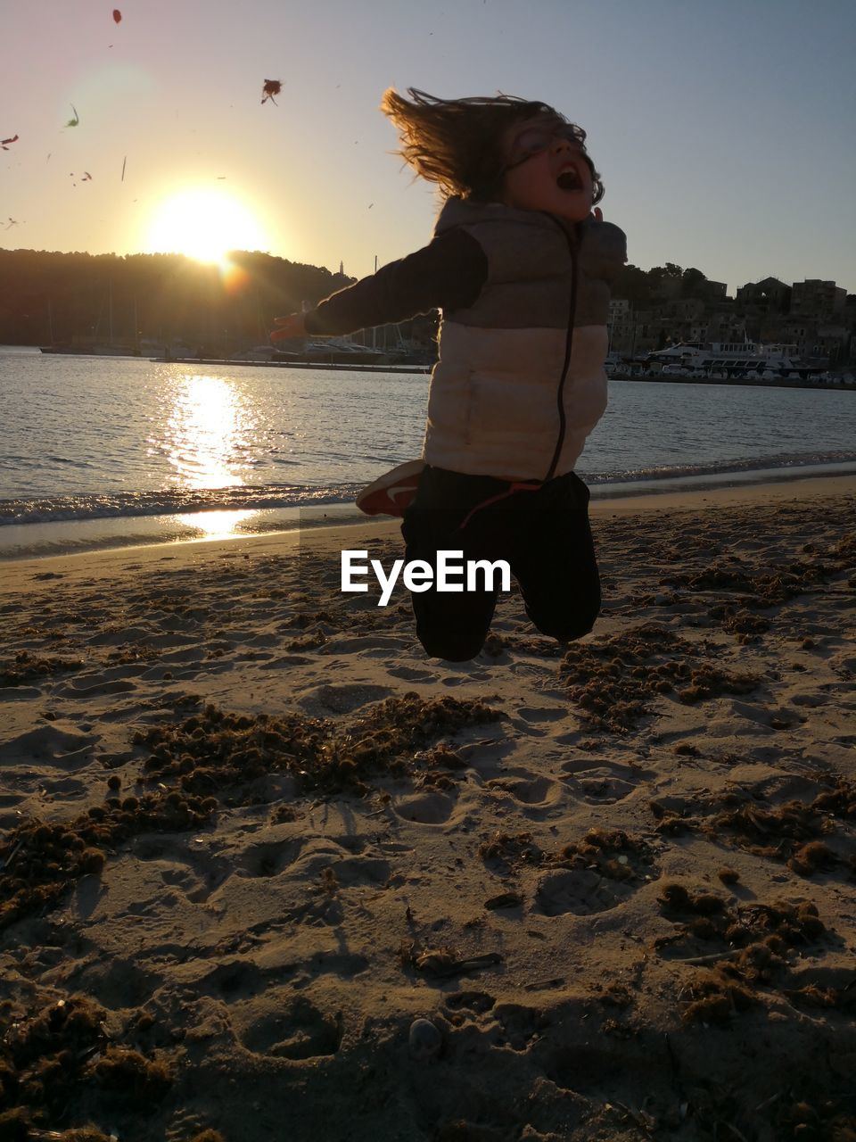 FULL LENGTH OF BOY ON BEACH