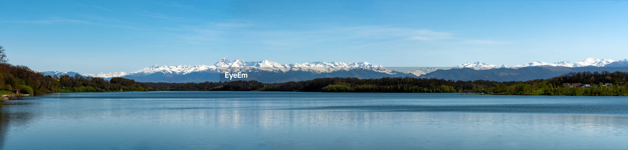 Scenic view of lake against blue sky