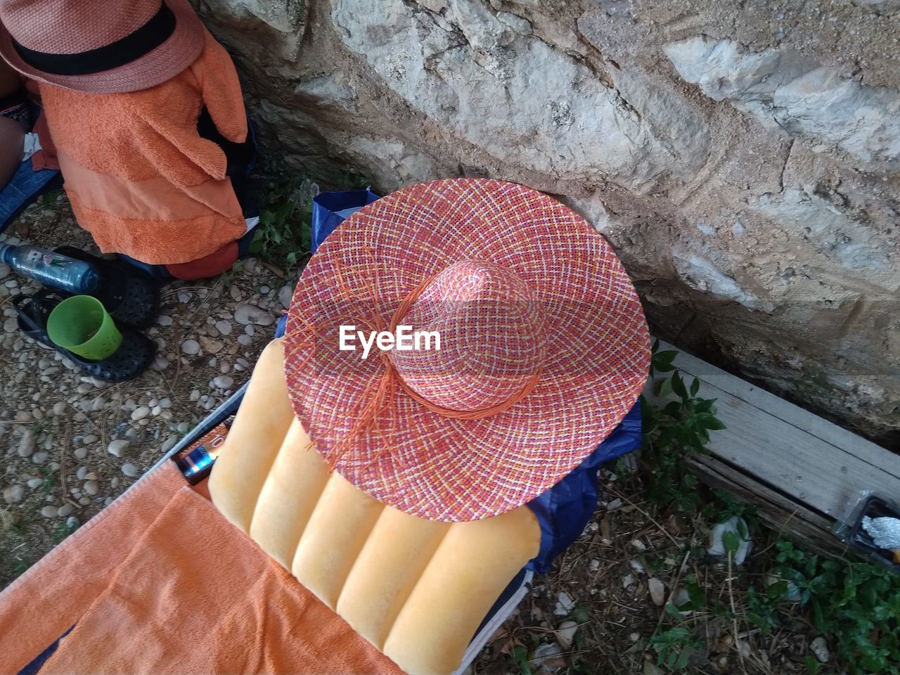 High angle view of hat on chair
