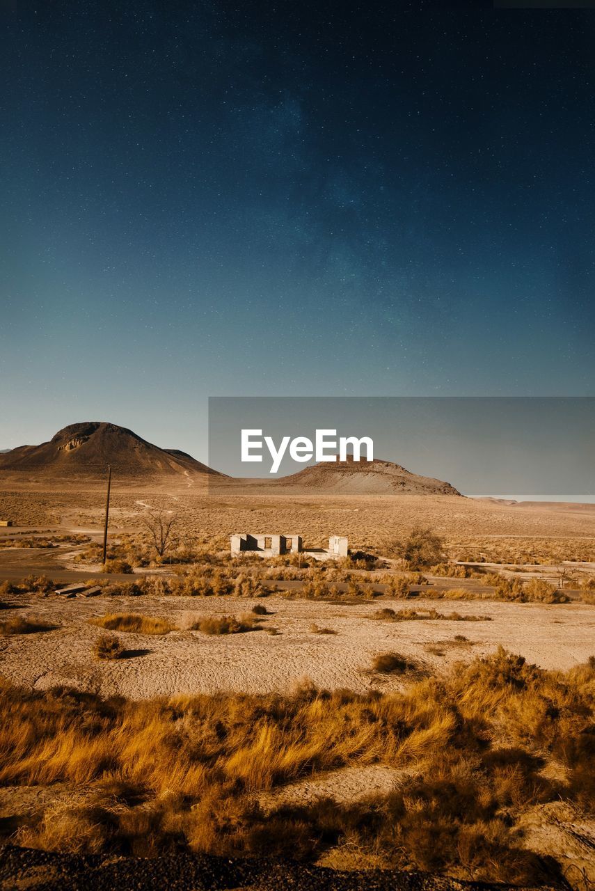Scenic view of landscape against sky at night