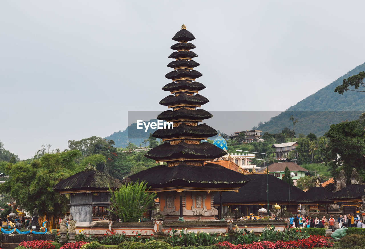 LOW ANGLE VIEW OF PAGODA AGAINST SKY IN CITY