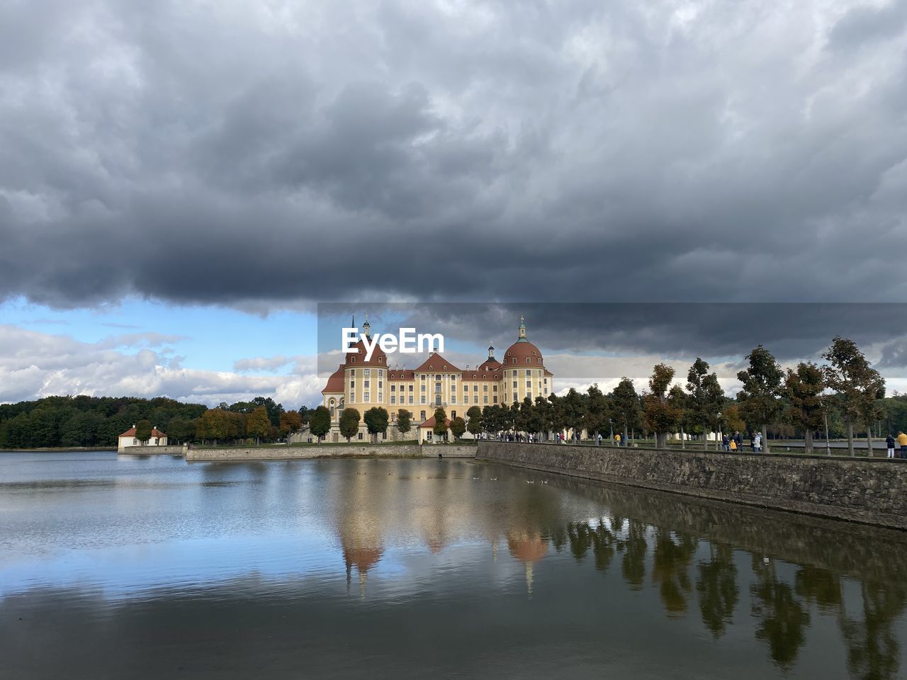 REFLECTION OF BUILDING ON LAKE