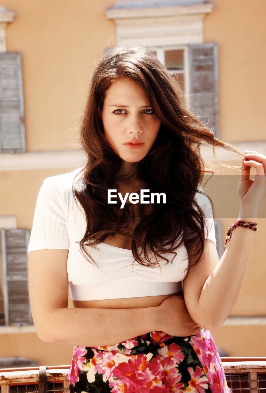 Portrait of young woman at terrace