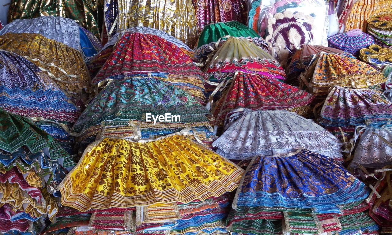 High angle view of colorful skirts for sale at market stall