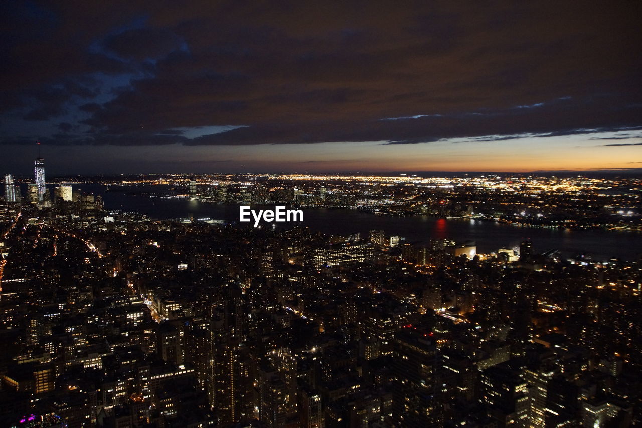 Aerial view of illuminated cityscape at night