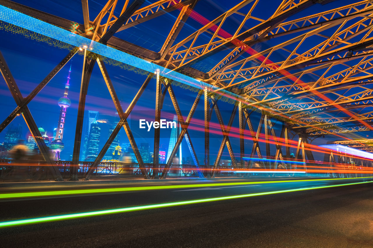 ILLUMINATED LIGHT TRAILS ON ROAD