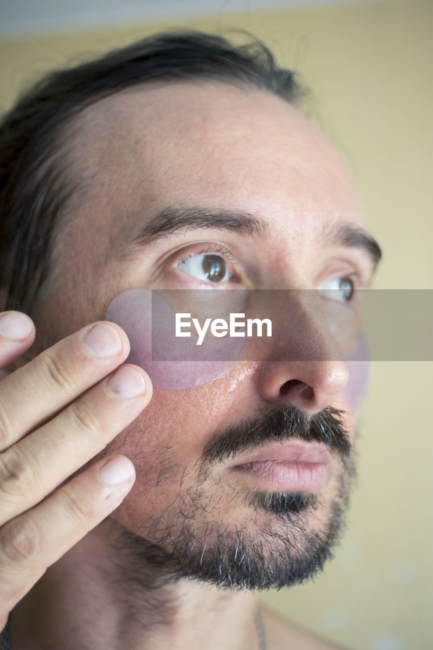 human face, portrait, human hair, facial hair, human head, adult, nose, close-up, one person, beard, skin, headshot, human eye, men, cheek, indoors, looking at camera, mature adult, human mouth, person, chin, hairstyle, body care, moustache, eyebrow, front view, eye, studio shot, focus on foreground, forehead, lifestyles, looking