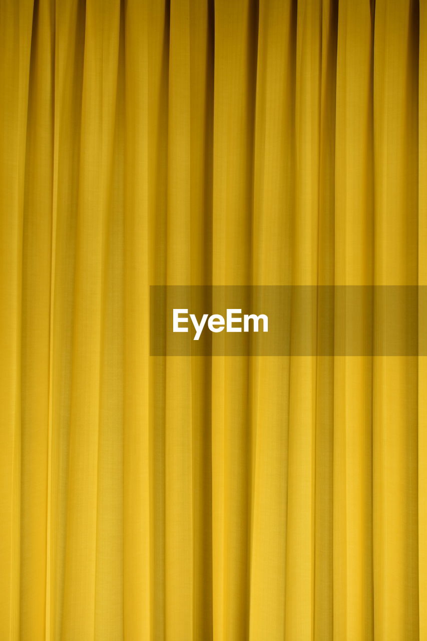 Full frame shot of yellow curtain