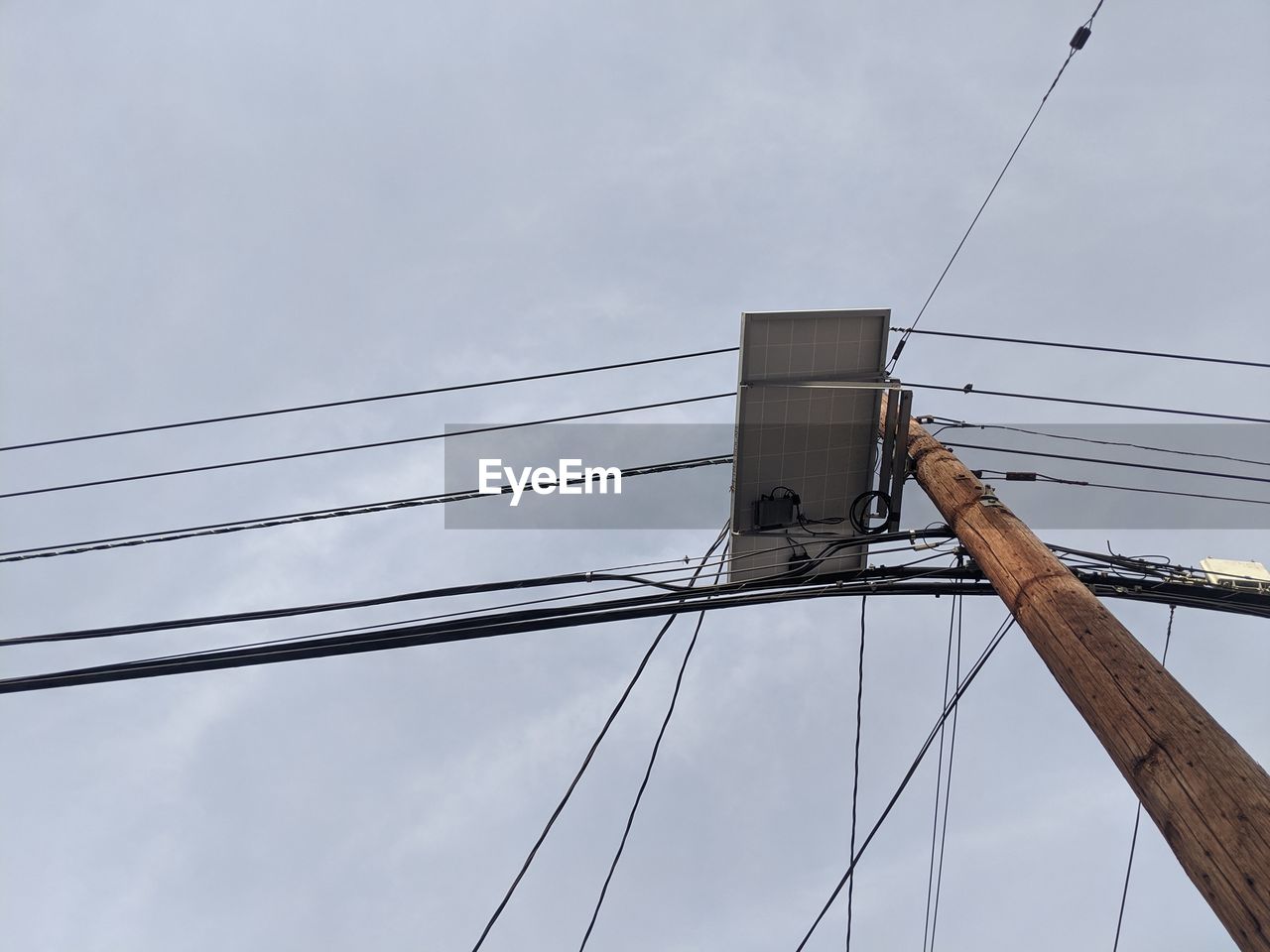 Low angle view of electricity pylon against sky