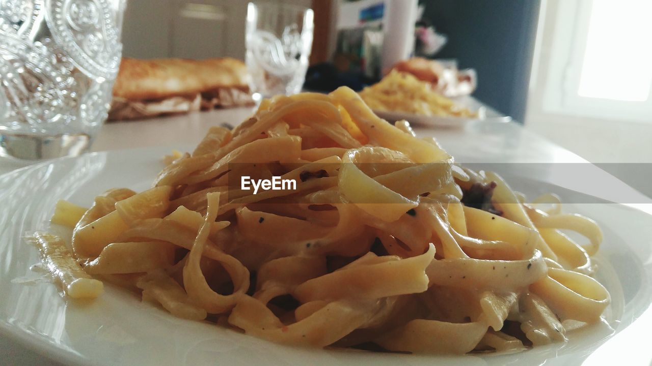 CLOSE-UP OF SERVED FOOD ON TABLE