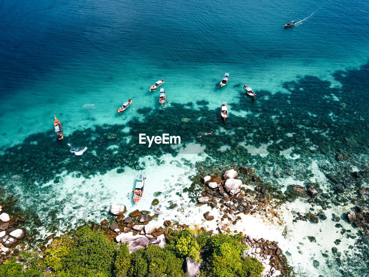 High angle view of people swimming in sea