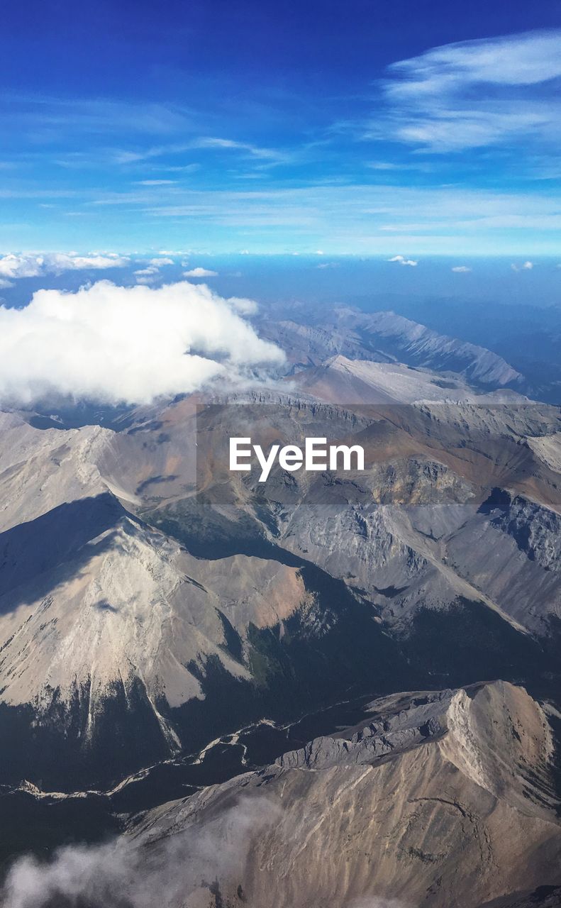 Aerial view of mountain landscape against sky