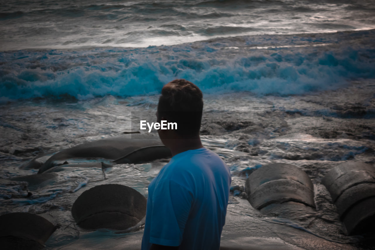 Rear view of man on beach