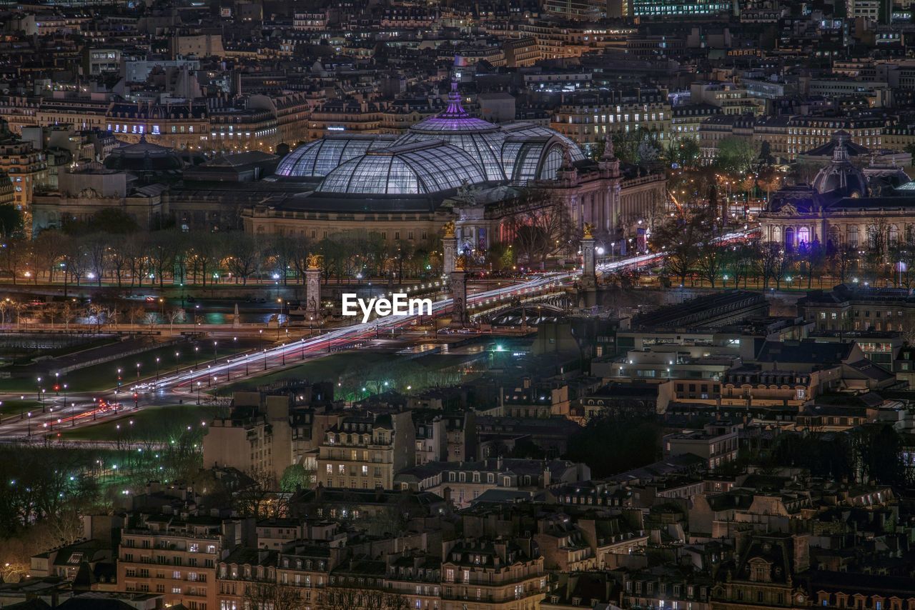 High angle view of city lit up at night