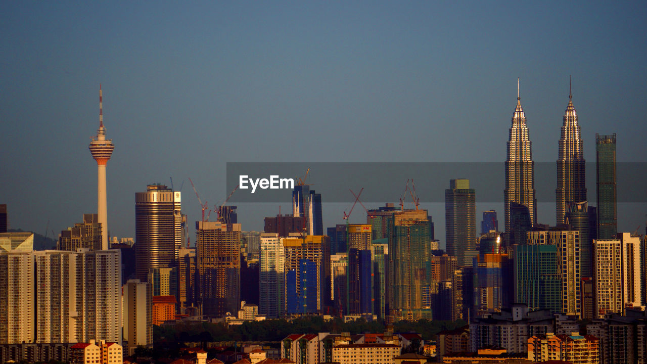 BUILDINGS IN CITY AGAINST SKY