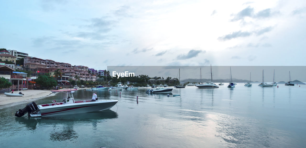 BOATS MOORED IN MARINA