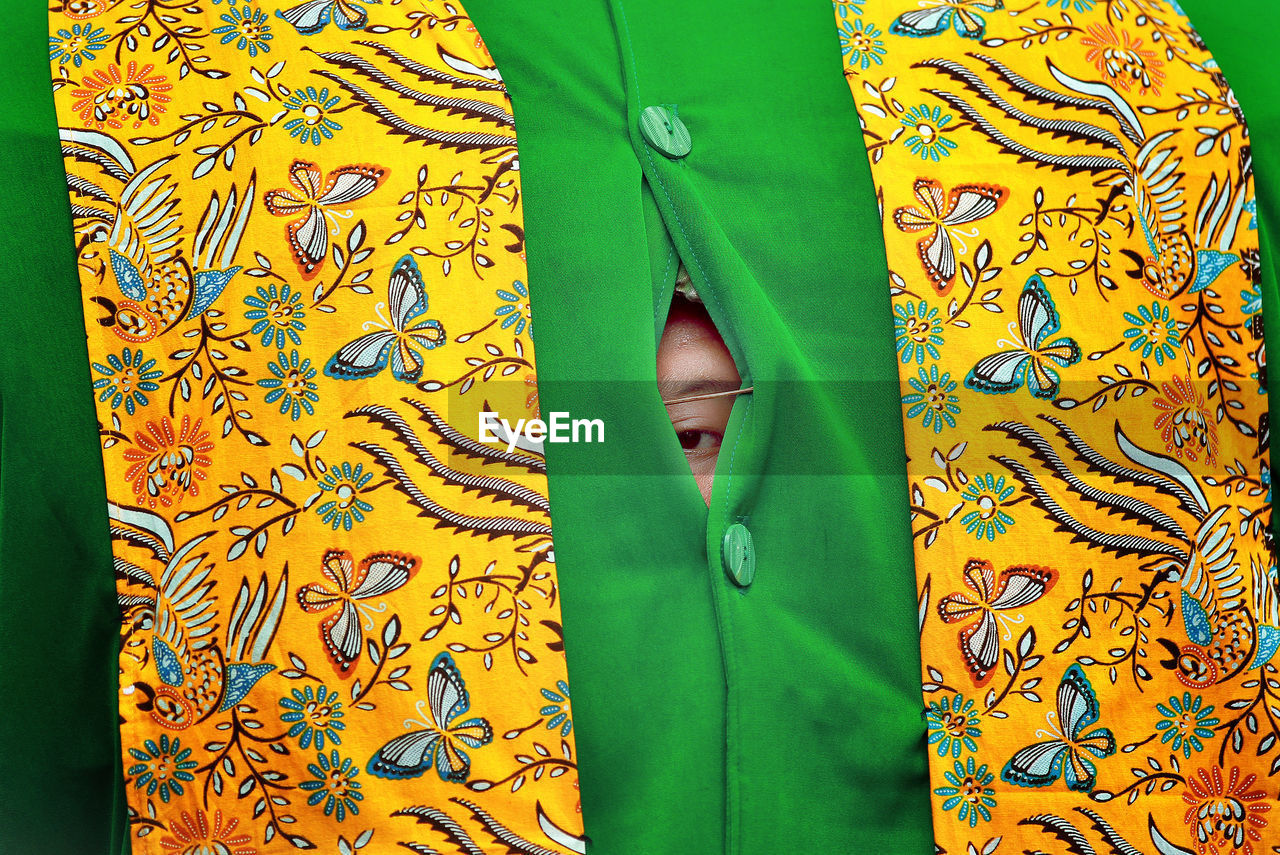 Portrait of child peeking through tent