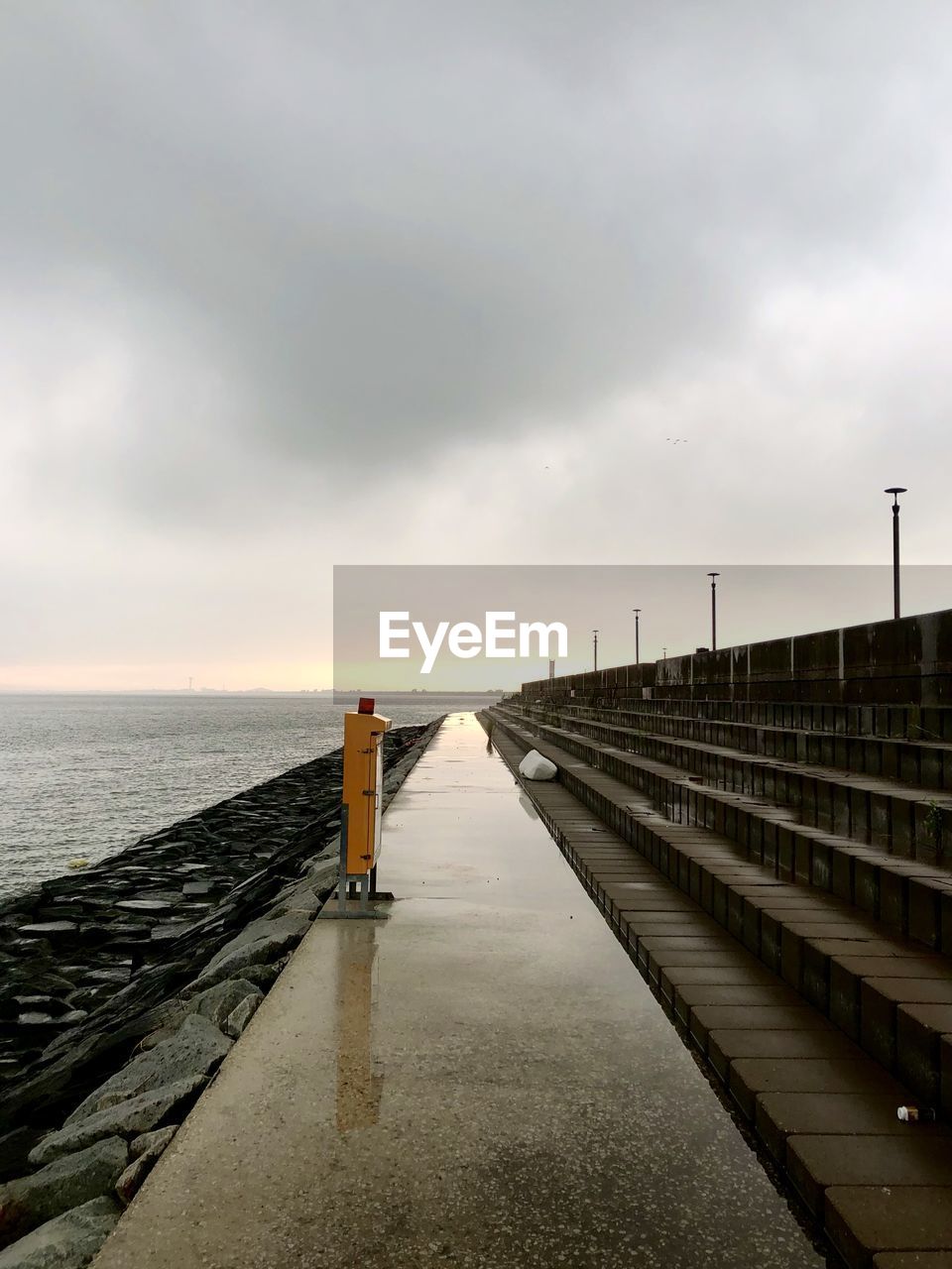 Pier over sea against sky