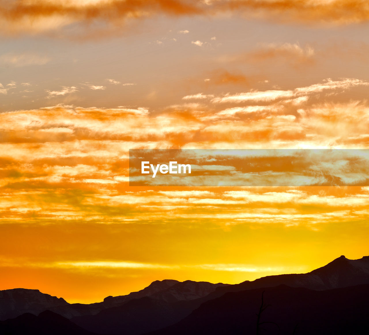 Scenic view of dramatic sky during sunset