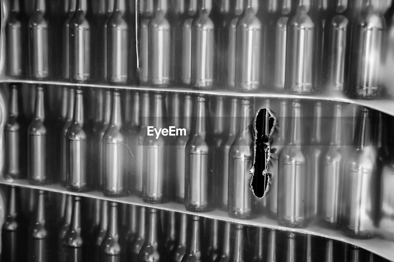 Close-up of glass bottles on shelf