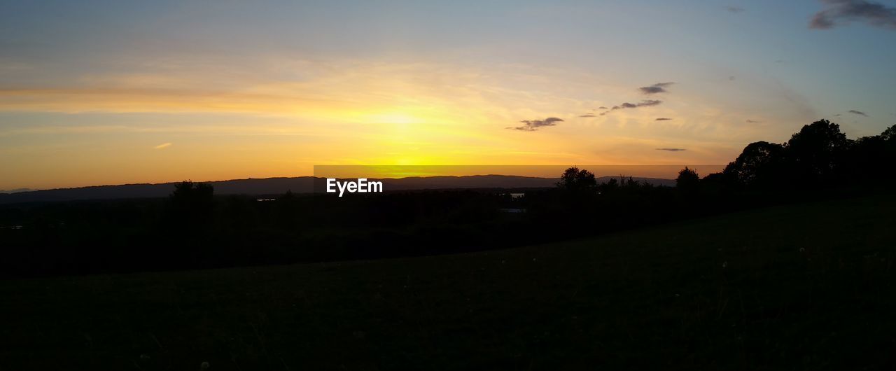 SILHOUETTE LANDSCAPE AT SUNSET