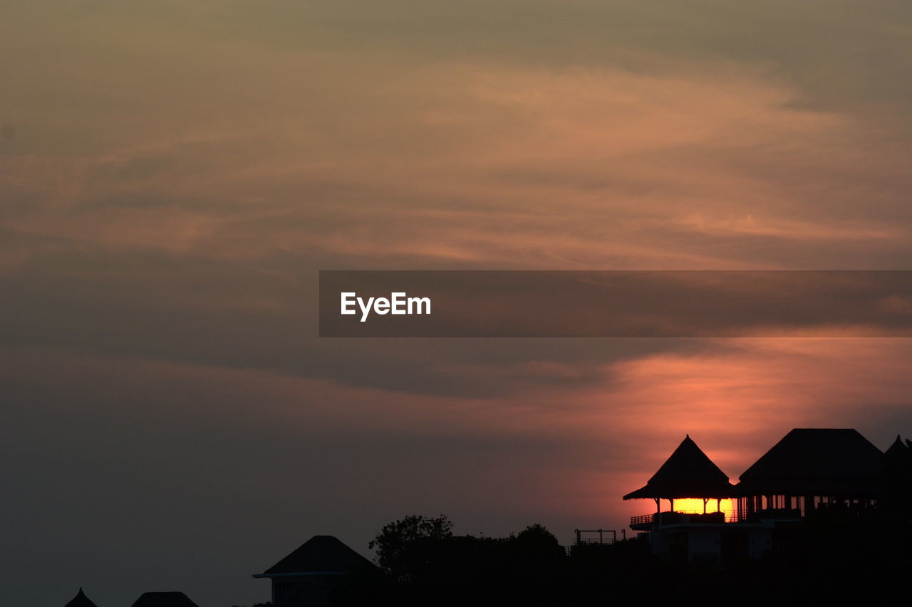 sky, architecture, built structure, house, building exterior, cloud, building, sunset, silhouette, dawn, nature, residential district, no people, evening, beauty in nature, hut, roof, scenics - nature, horizon, tranquility, outdoors, idyllic, night, afterglow, tranquil scene, travel destinations, dramatic sky, copy space