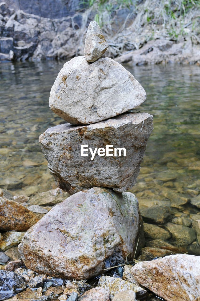 CLOSE-UP OF STONE STACK ON ROCK