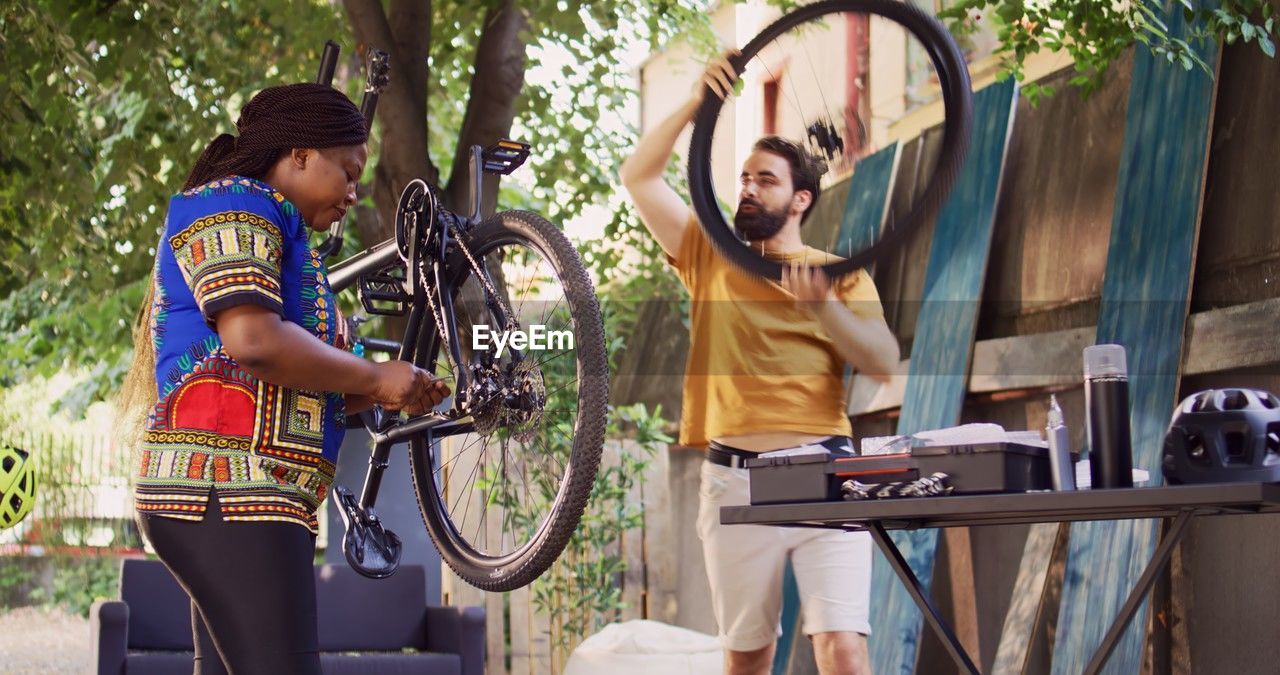 side view of man riding bicycle in park