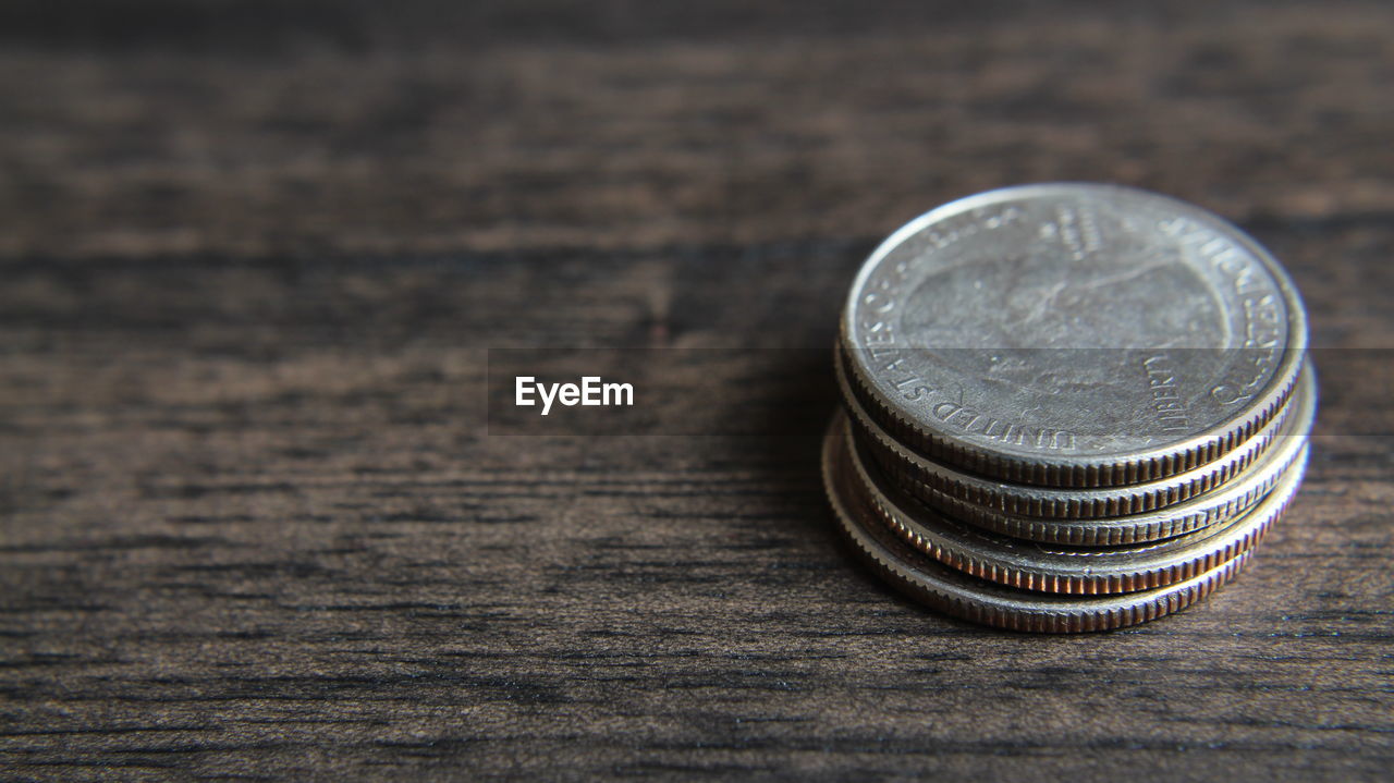 Close-up of coins on table
