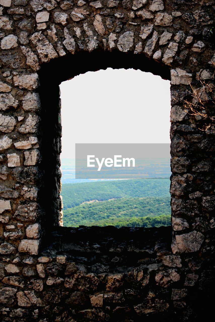 WINDOW ON STONE WALL