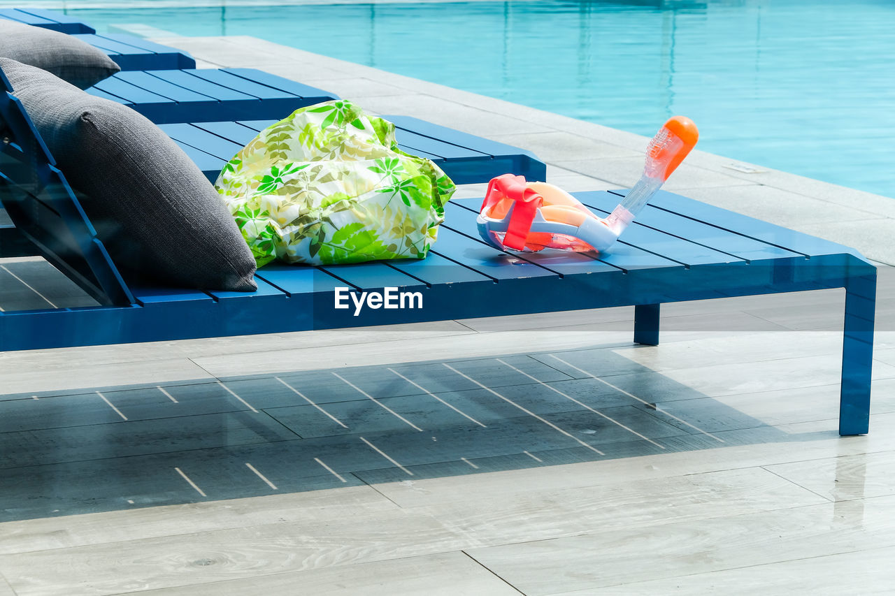 High angle view of food on table at swimming pool