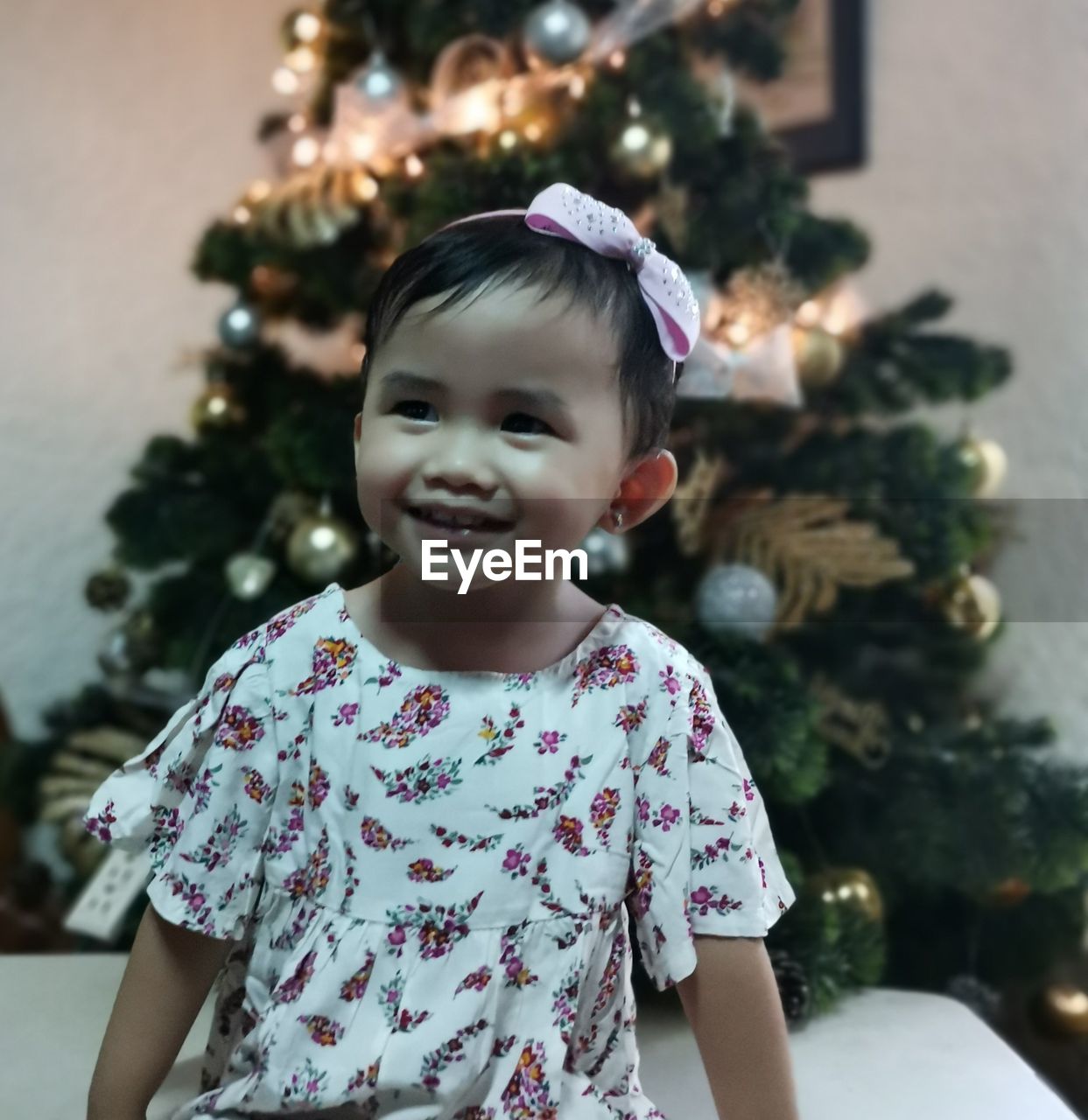 Portrait of girl with christmas tree