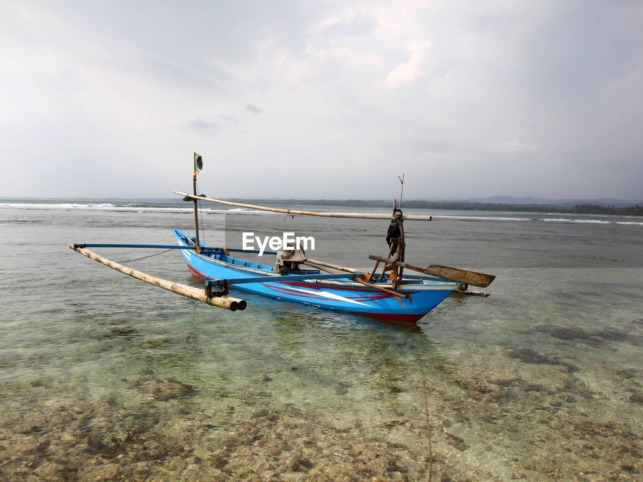 water, sea, transportation, nautical vessel, sky, boat, mode of transportation, beach, land, vehicle, nature, boating, travel, shore, cloud, horizon over water, beauty in nature, scenics - nature, tranquility, watercraft, men, two people, horizon, day, adult, holiday, trip, coast, sand, vacation, outdoors, tranquil scene, travel destinations, ocean, long-tail boat, bay, environment, blue, idyllic, occupation, tourism, non-urban scene, motion, coastline, sports, activity, full length, seascape, wave, fisherman, leisure activity, sunlight