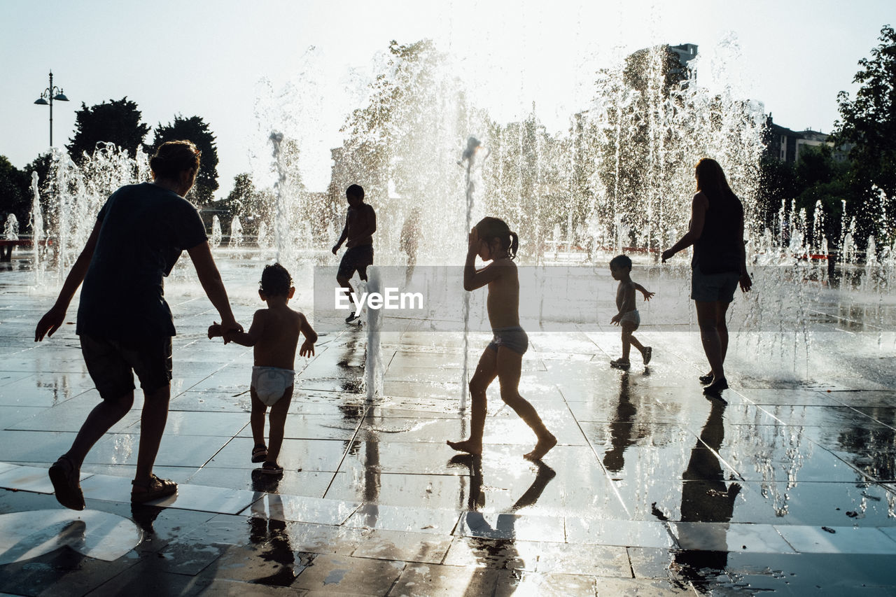 PEOPLE STANDING ON WATER