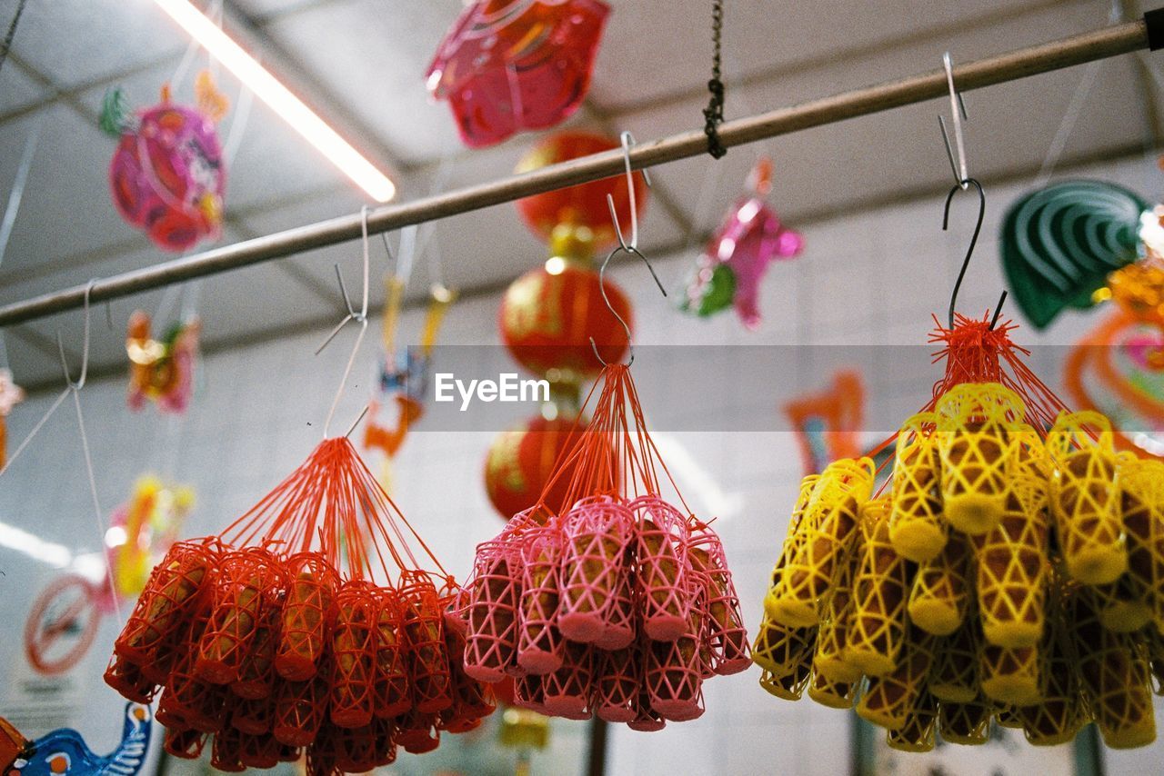 Low angle view of colorful decorations hanging for sale