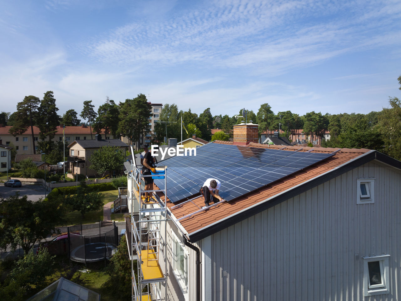 Installation of solar panels on roof of house