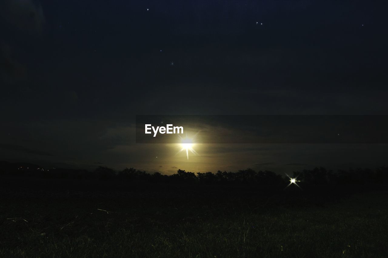 SCENIC VIEW OF FIELD AGAINST MOON IN SKY
