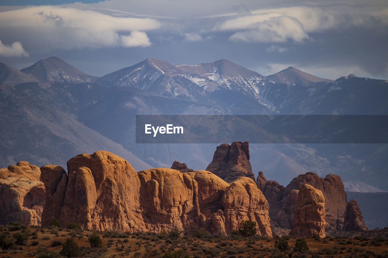 Canyon with snowy mountains on back in utah arches national park