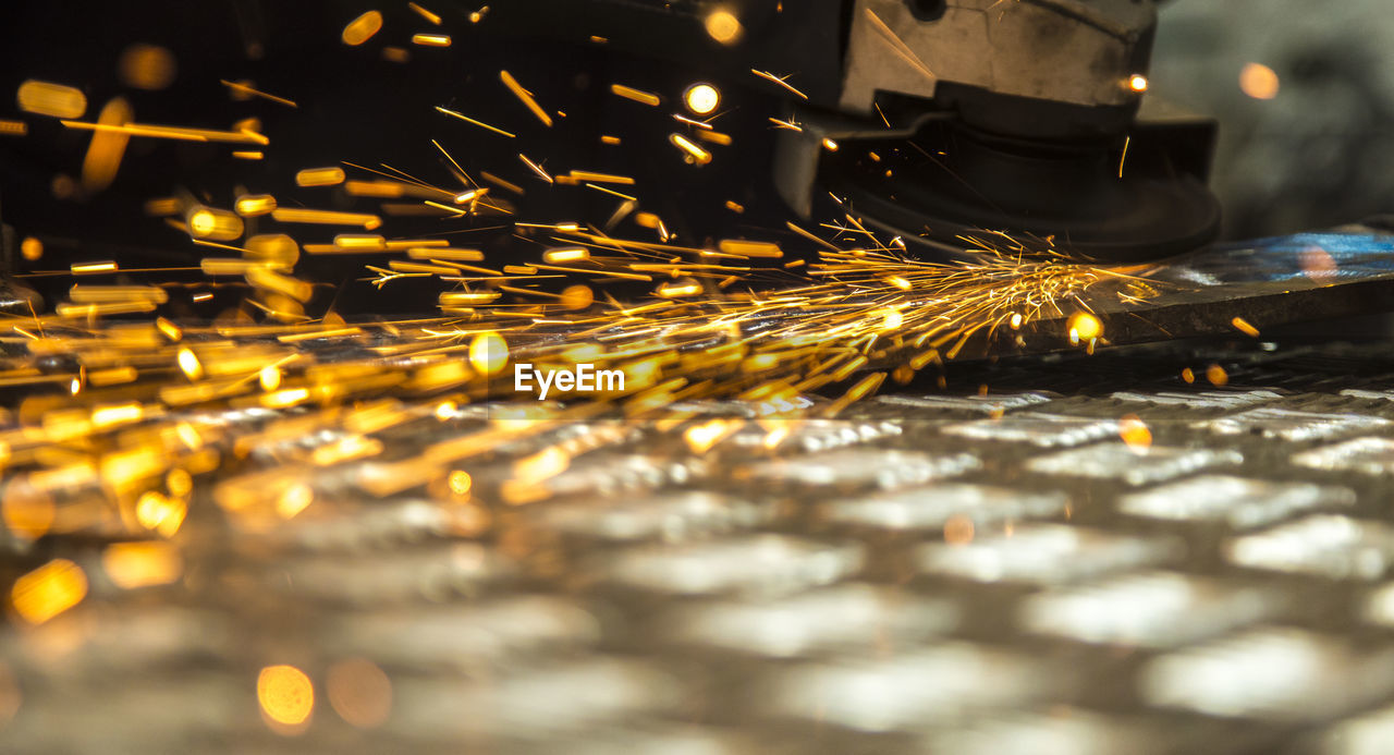 Close-up of metal being cut with handsaw