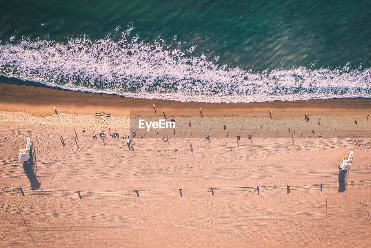 HIGH ANGLE VIEW OF PEOPLE ON BEACH