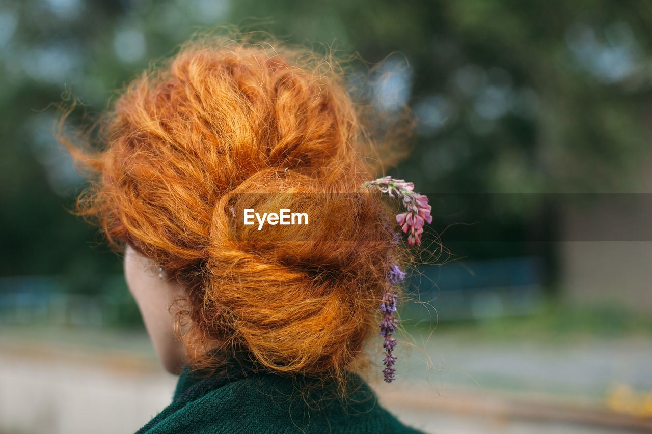 Close-up rear view of a young woman