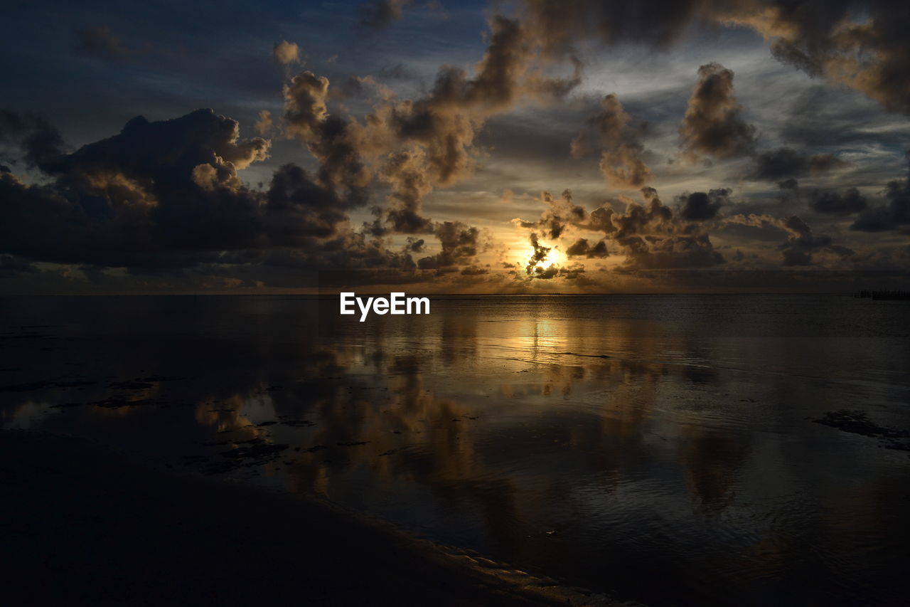 Scenic view of sea against sky at sunset