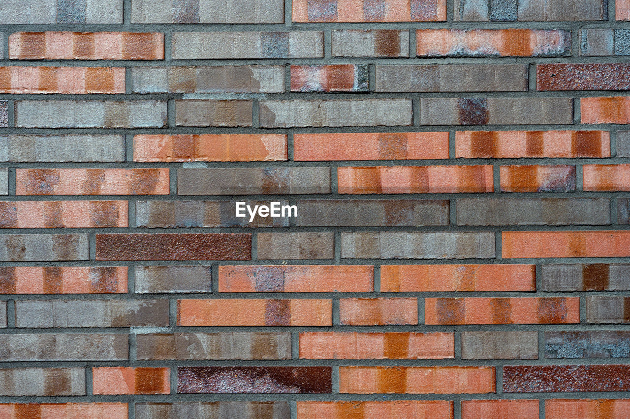 Background from a brick wall with different shades of red