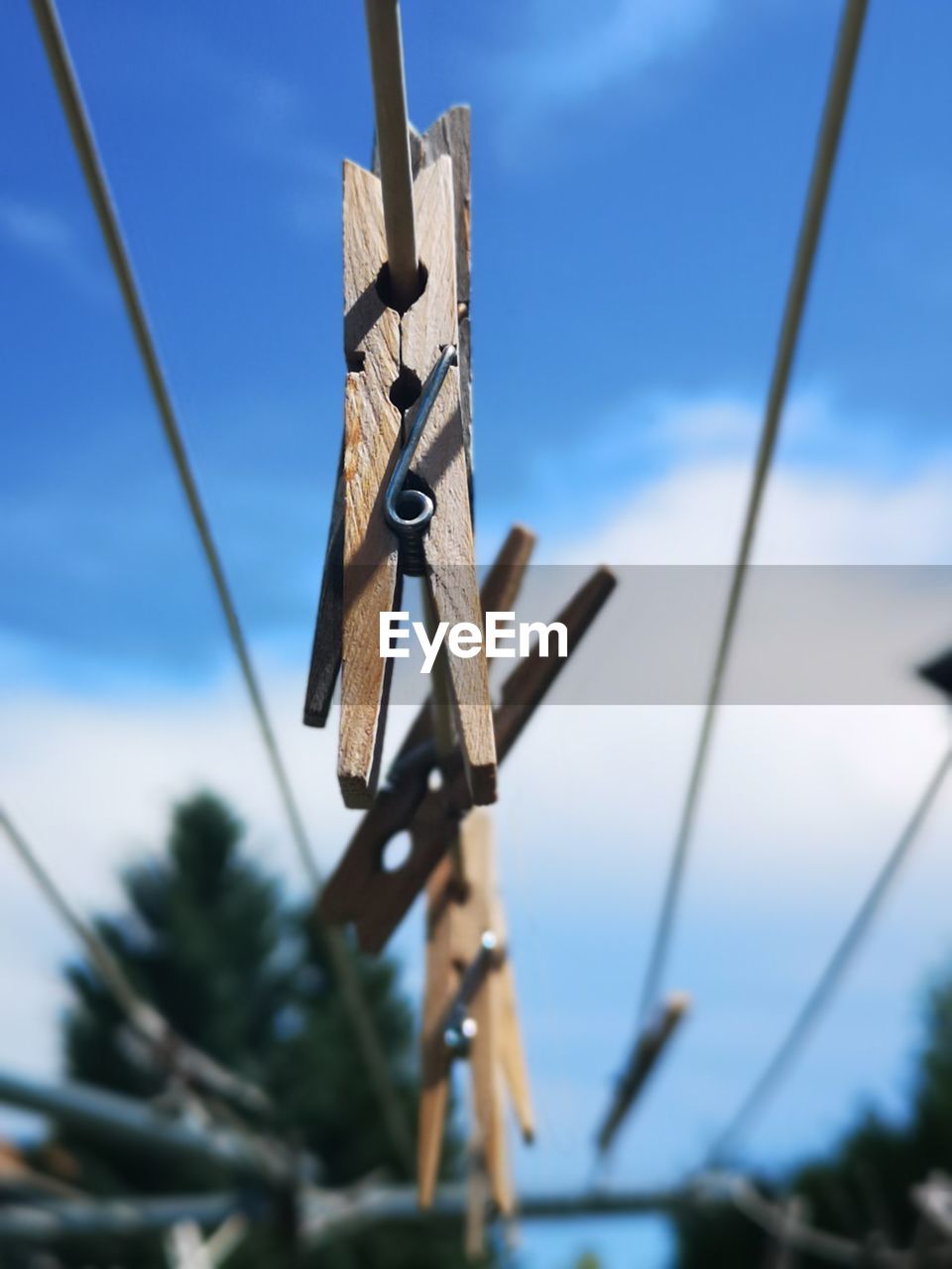 LOW ANGLE VIEW OF ROPES AGAINST SKY