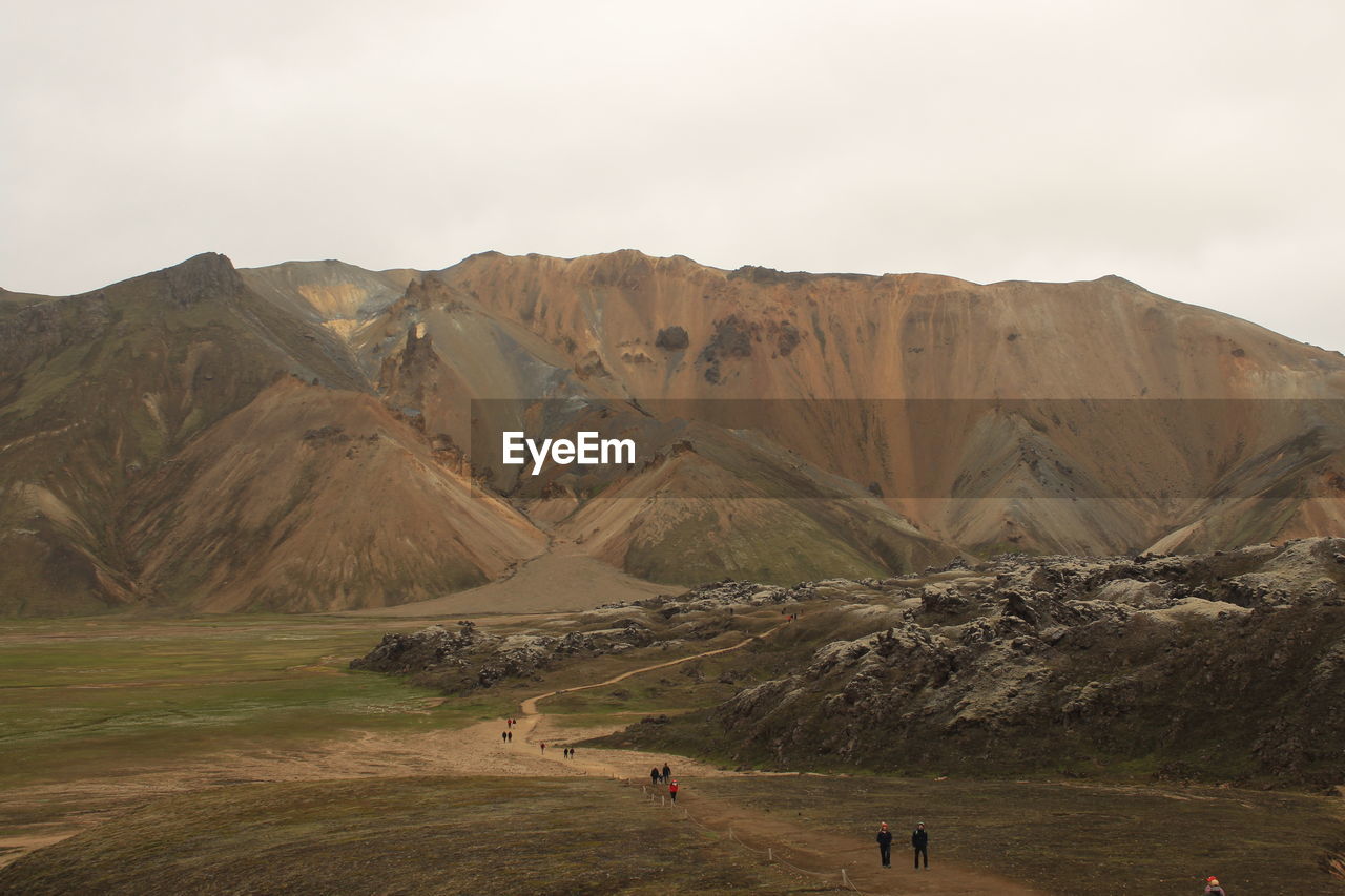 SCENIC VIEW OF LANDSCAPE AND MOUNTAINS AGAINST SKY