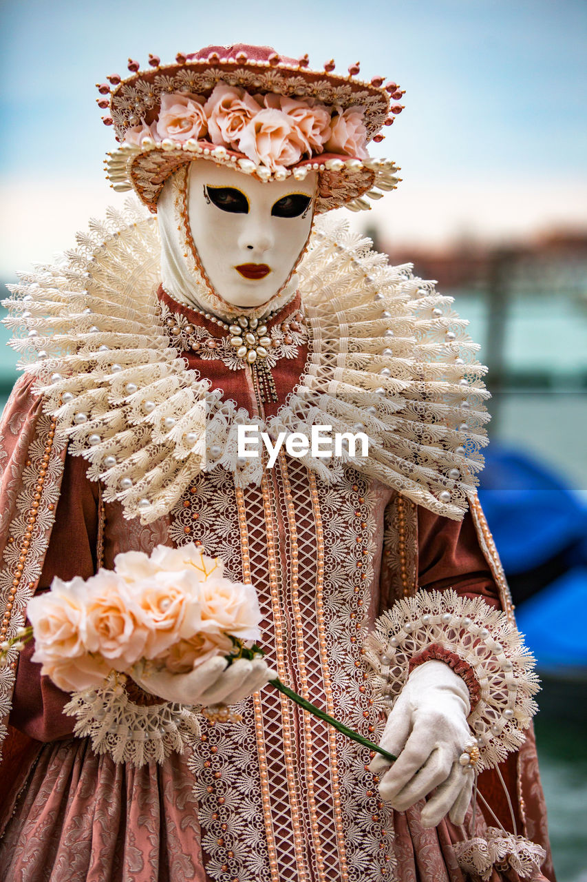 Woman wearing costume and mask during venice carnival